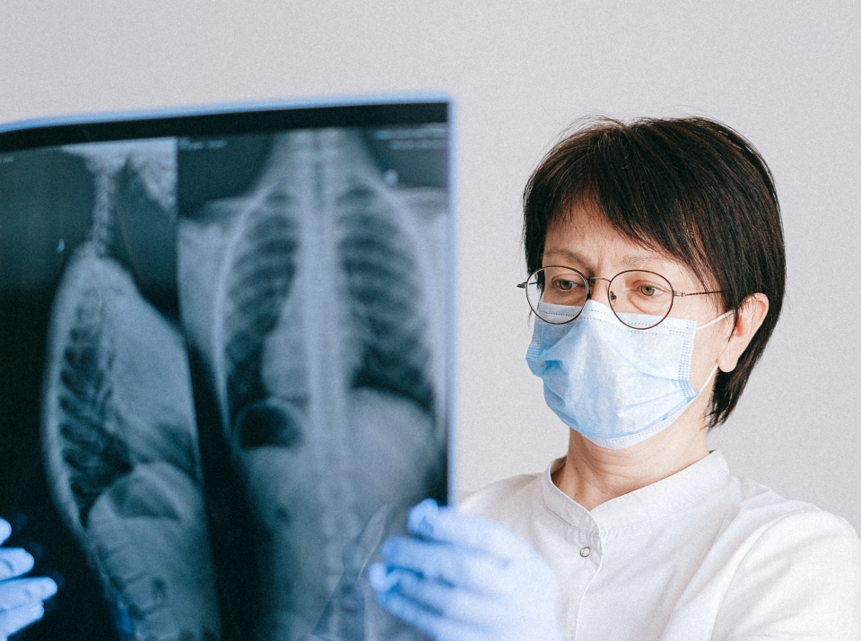 Woman Doctor Studying X ray Result of Patient | Women's Imaging Clinic | Radiology Tasmania