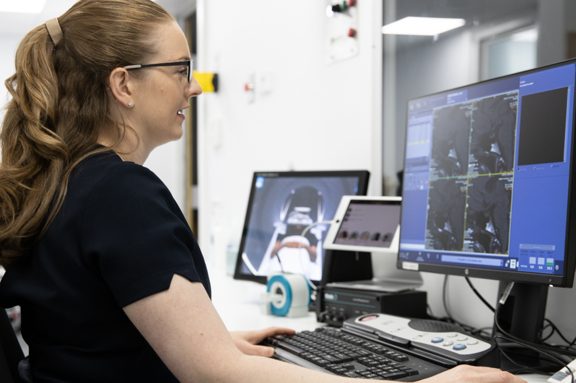 Woman Doctor Looking At X ray Result on Screen | Radiology CT Scan Centre | Radiology Tasmania