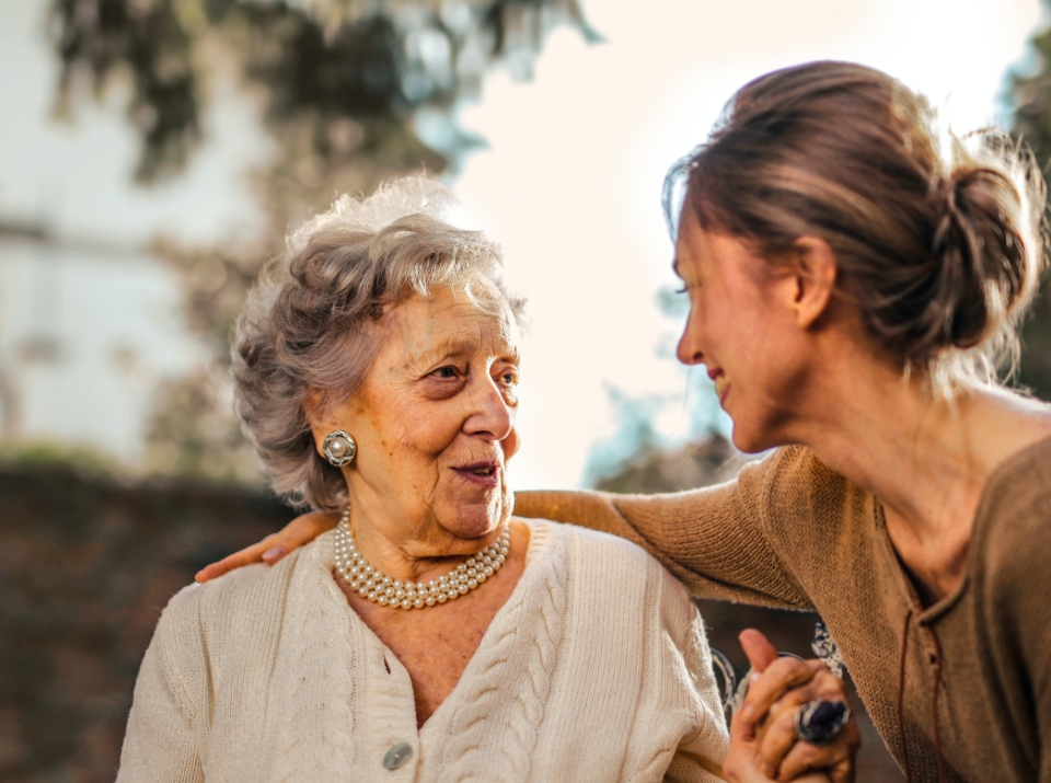 Elderly woman and carer