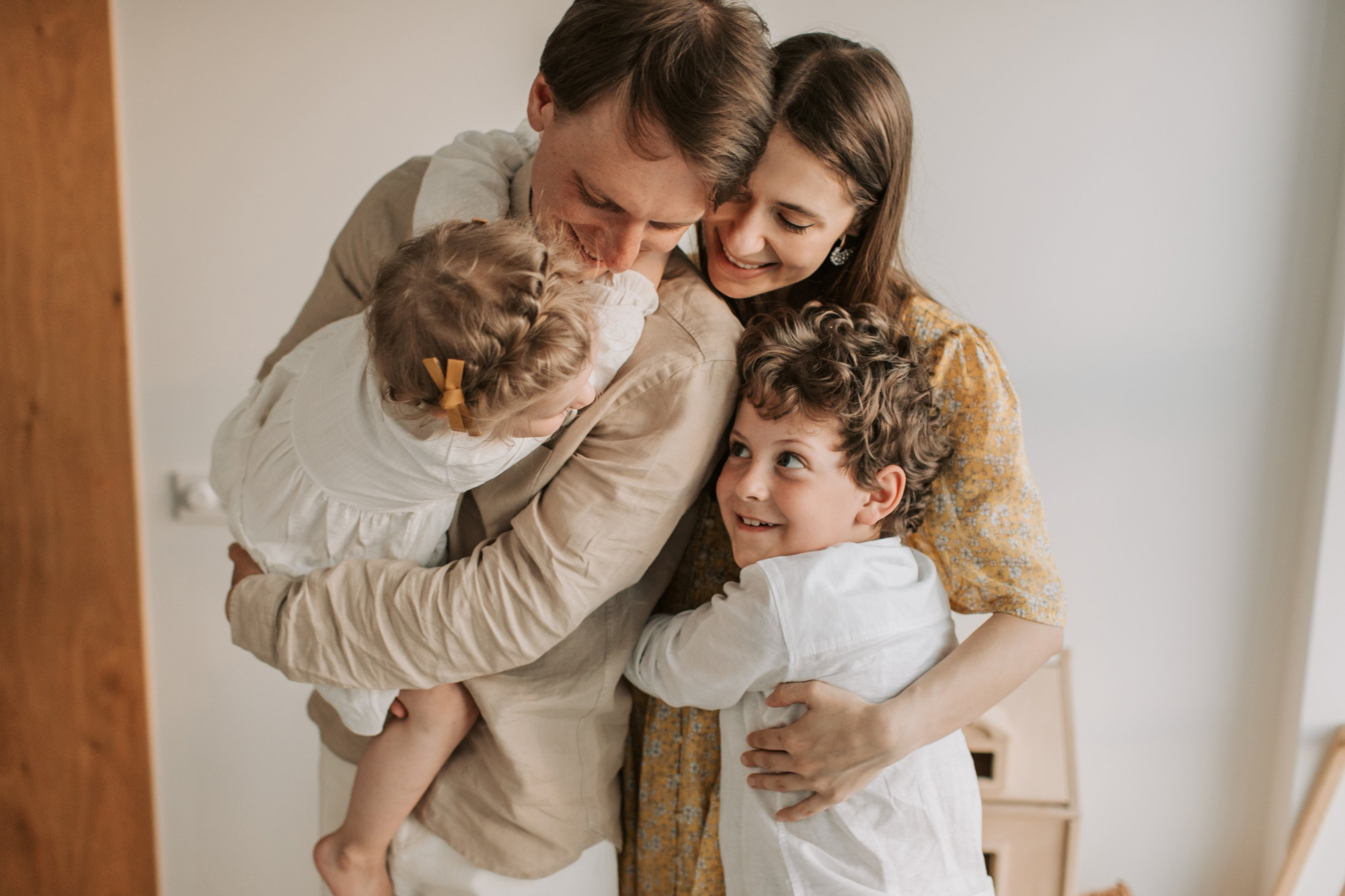 Family of Four Hugging Each Other Happily | Radiology CT Scan Centre | Radiology Tasmania